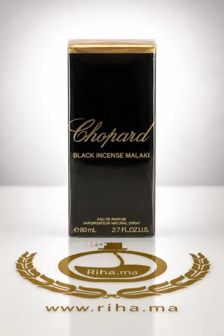 Flacon de parfum black incense malaki chopard sur fond sombre élégant