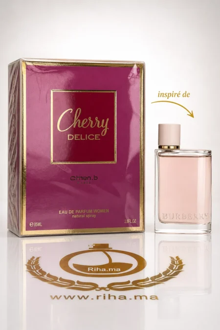 Flacon de parfum Cherry Delice Johan B posé sur fond rose délicat