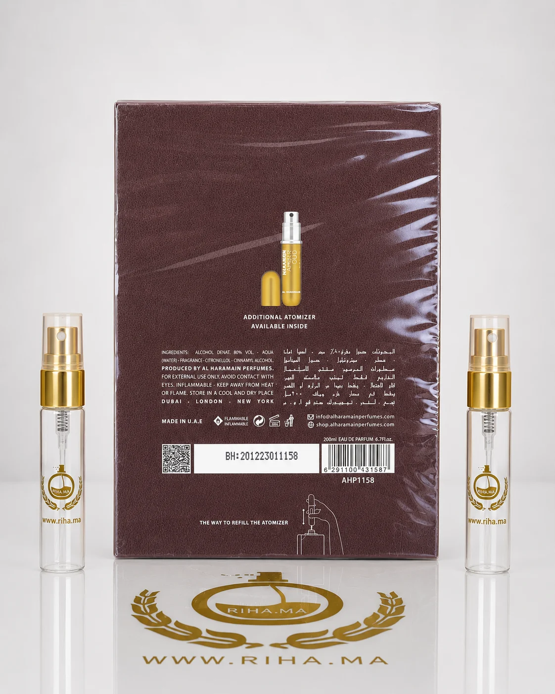 Decantage Amber Oud Al Haramain Perfumes Eau De Parfum Authentic — photo 2 decantage amber oud al haramain perfumes — Flacon de décantage amber oud al haramain perfumes posé sur fond doré — vue 2