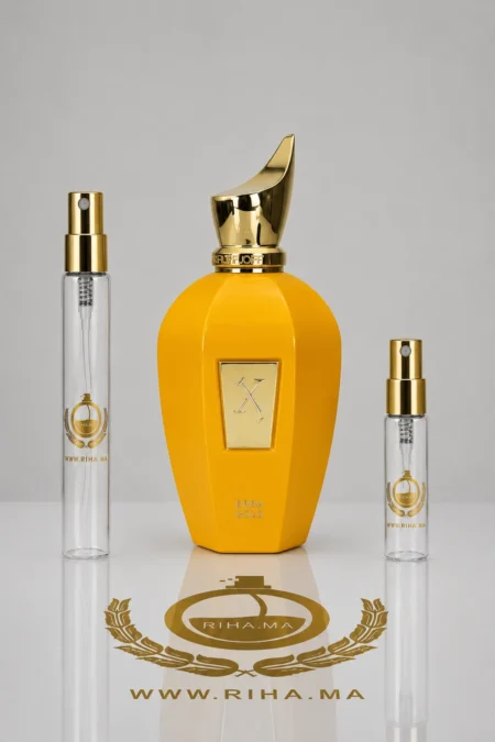 Flacon de decantage erba gold xerjoff pour femme posé sur fond doré