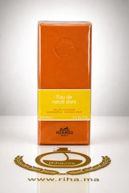 Flacon d'eau de néroli doré Hermès sur fond doré