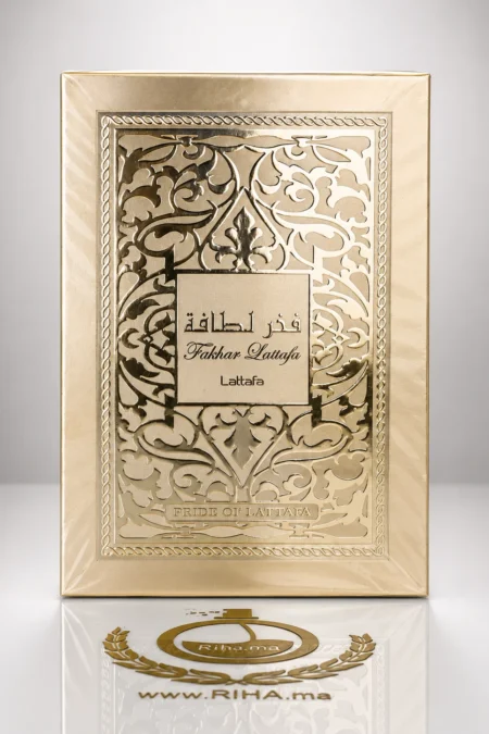 Flacon de parfum Fakhar de Lattafa posé sur fond doré