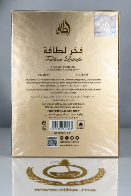 Flacon de parfum Fakhar de Lattafa posé sur fond doré — vue 2
