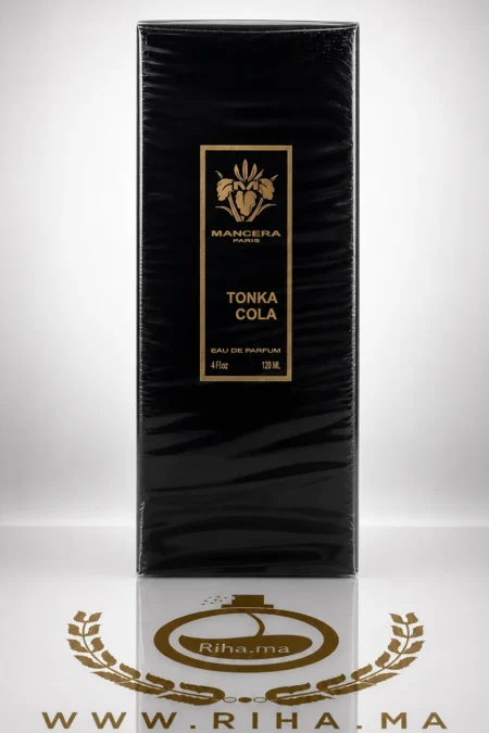 Flacon de parfum tonka cola mancera sur fond sombre élégant